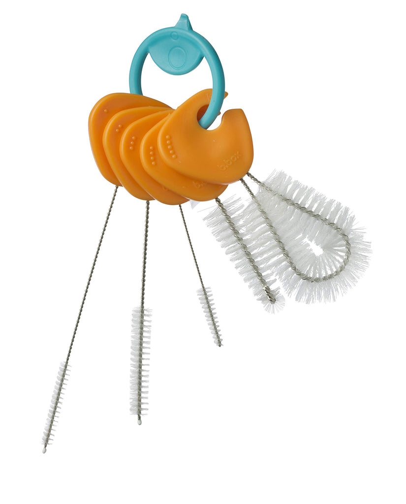 Set of orange straws with a blue holder on a white background