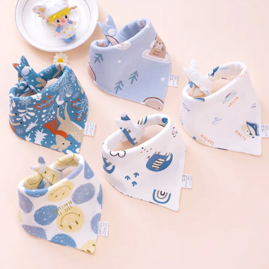 Set of baby bibs with cartoon designs on a light background