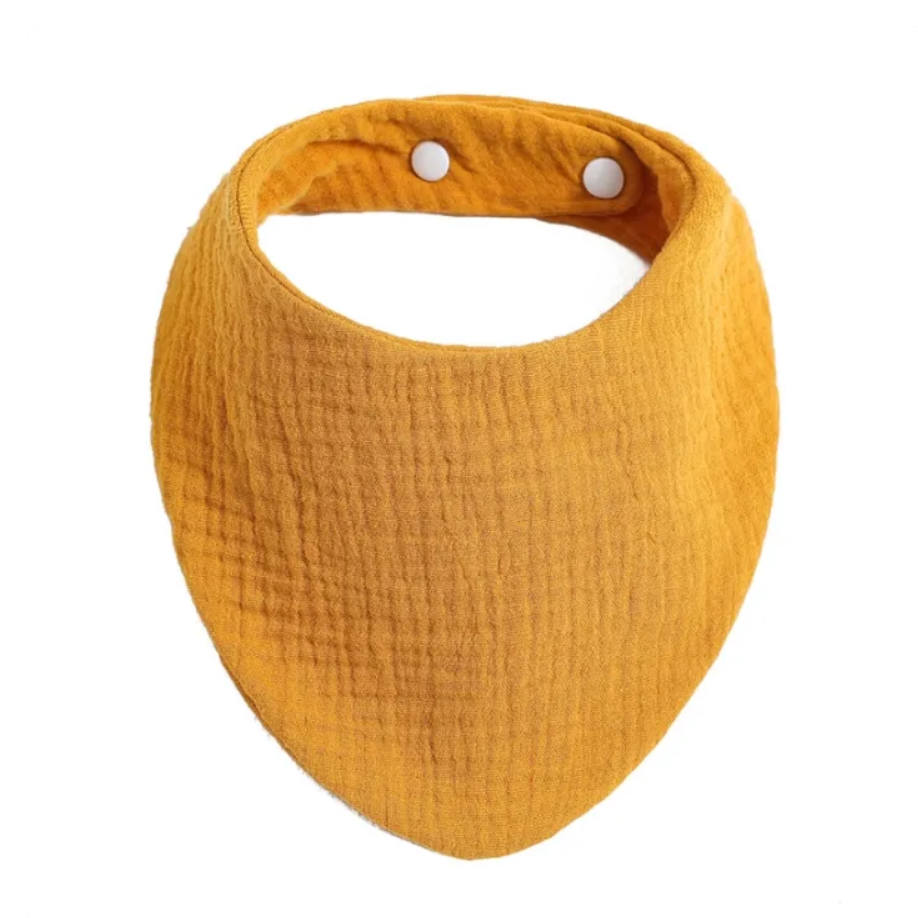 Yellow baby bib with white buttons on a white background