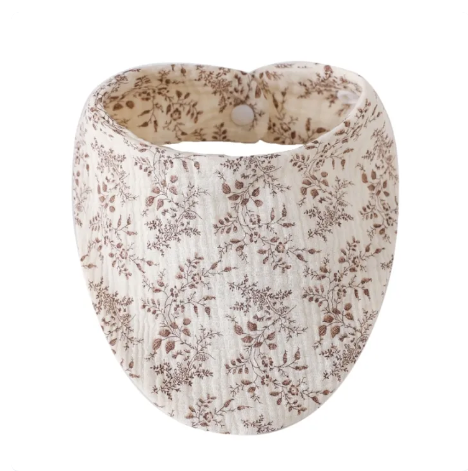 Floral-patterned fabric headband on a white background