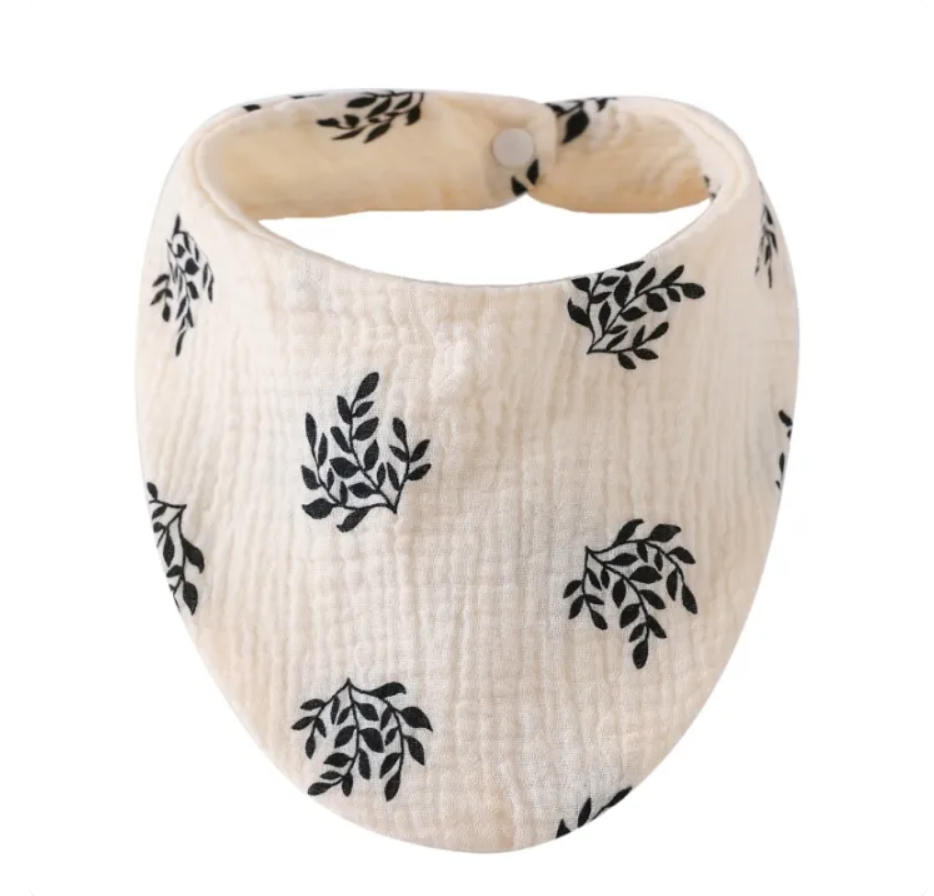 Baby bib with leaf pattern on a white background